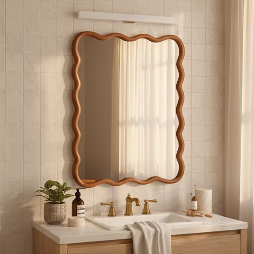 Natural wood bathroom mirror frame in a light neutral bathroom