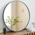 Round bathroom mirror with slim metal frame