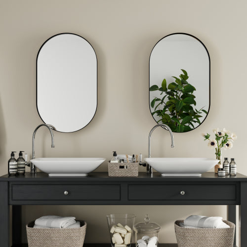 Oval medicine cabinet shown in modern bathroom