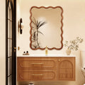 30x40 wavy solid wood bathroom mirror in a styled vanity setting