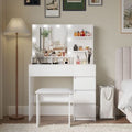 White makeup vanity with lighted mirror, power strip and stool